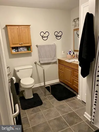 a bathroom with a toilet a sink and a shower