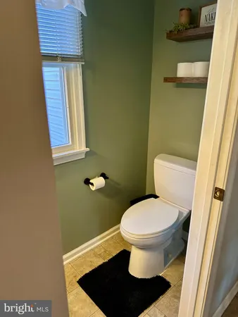 a bathroom with a toilet and a sink