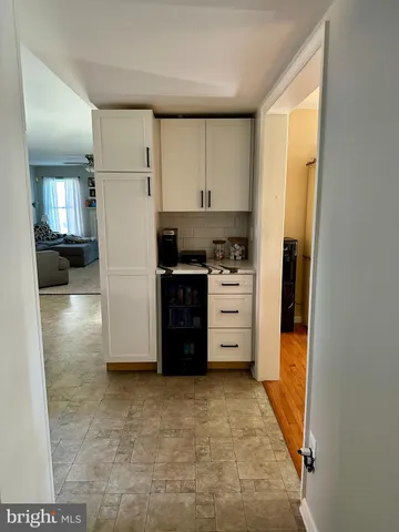 a kitchen with a cabinets and a stove top oven