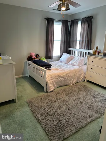 a bed room with a bed and a chandelier