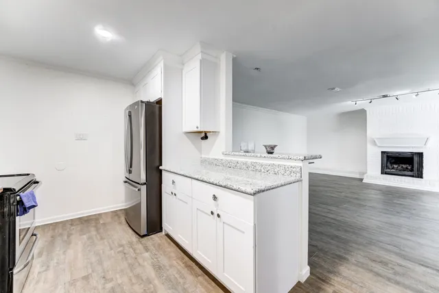 a kitchen with a sink stove and refrigerator