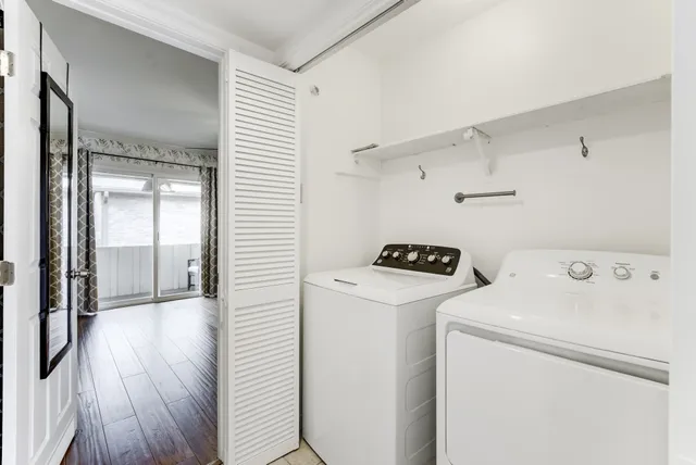 a view of storage and utility room with washer and dryer