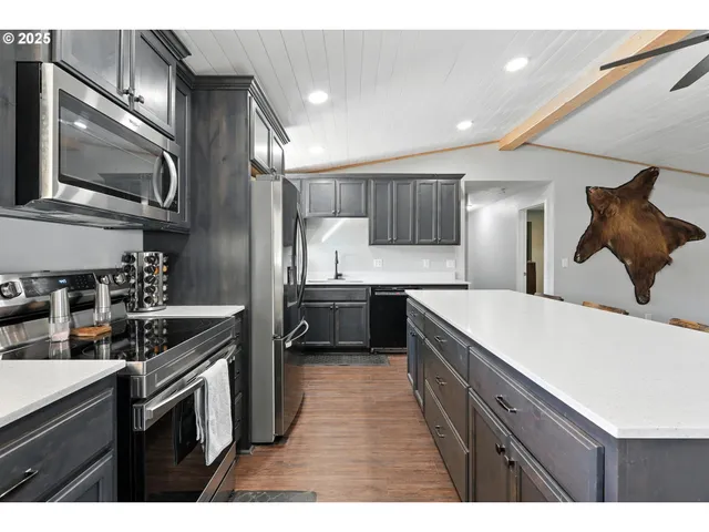 a kitchen with a sink stove and refrigerator