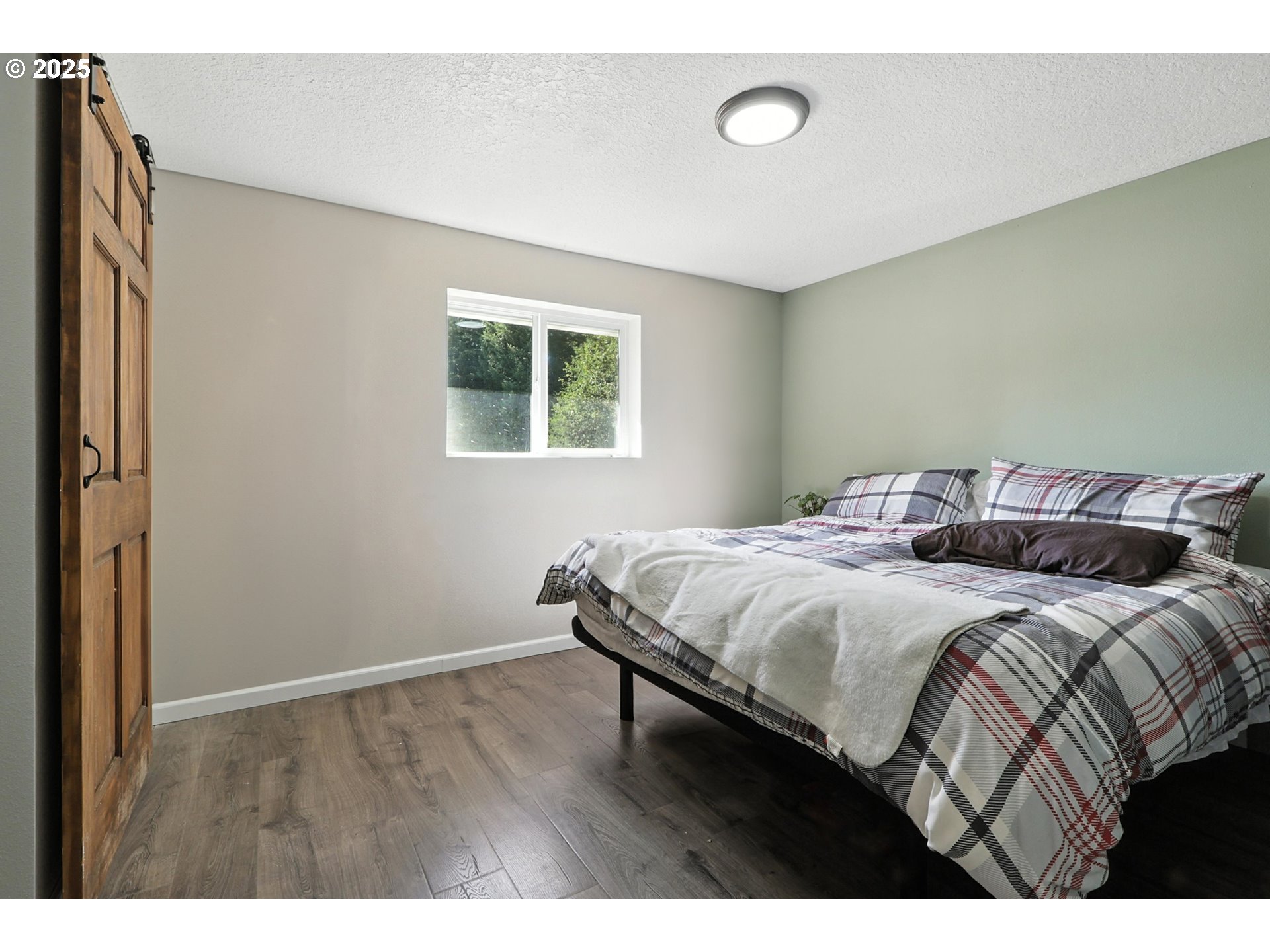 22404 Northeast Dole Valley Road Yacolt, WA 98675 - Photo 25 of 45 a bedroom with a bed and a window