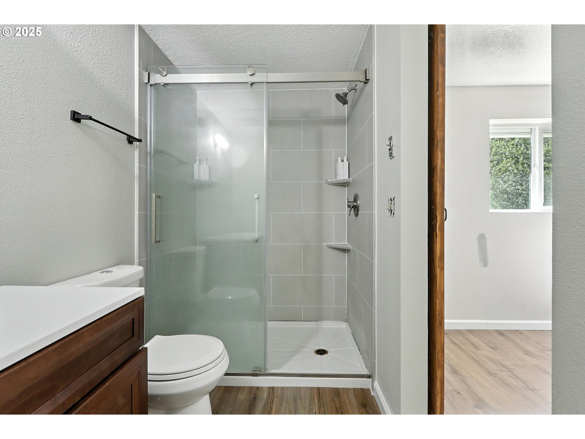 22404 Northeast Dole Valley Road Yacolt, WA 98675 - Photo 29 of 45 a bathroom with a shower a sink a toilet and a shower