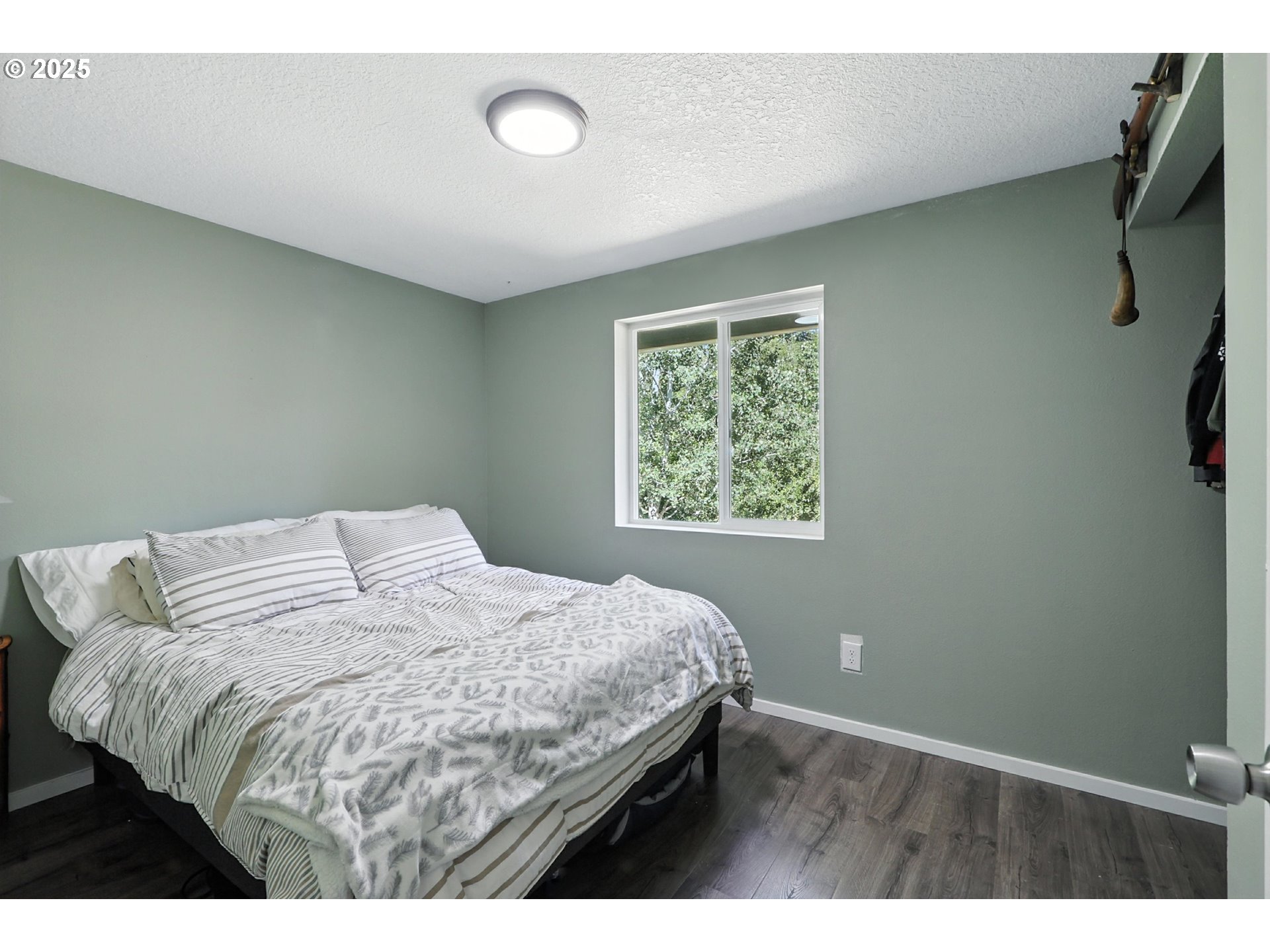 22404 Northeast Dole Valley Road Yacolt, WA 98675 - Photo 30 of 45 a bedroom with a bed and a window