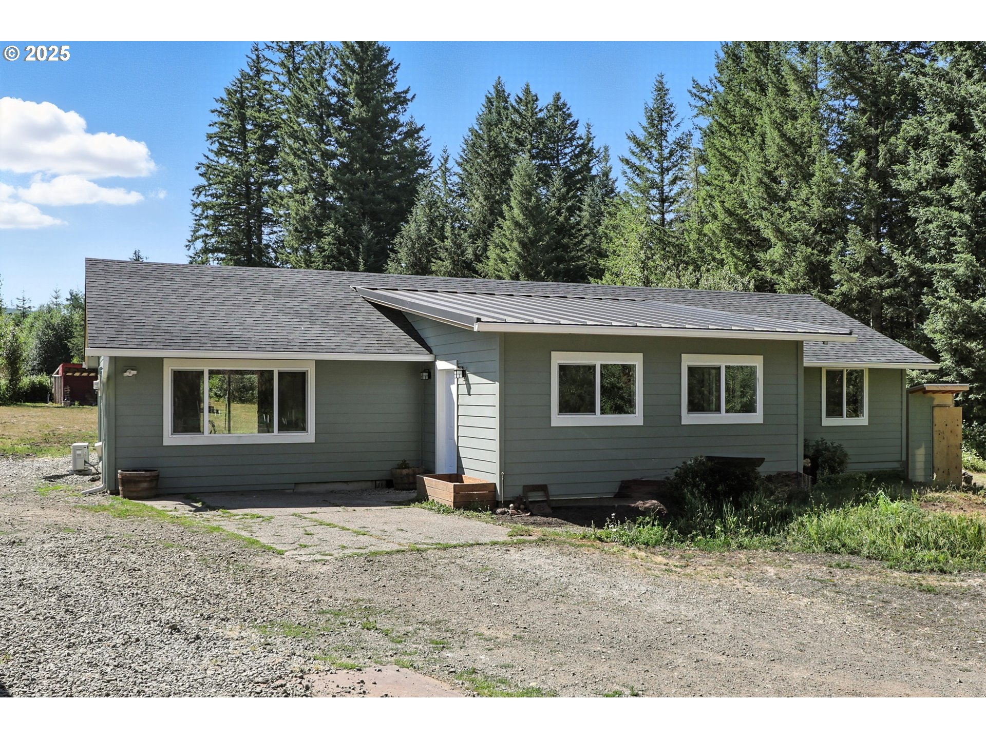 22404 Northeast Dole Valley Road Yacolt, WA 98675 - Photo 5 of 45 a view of a house with a yard and potted plants