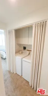 a bedroom with a bed and a night stand