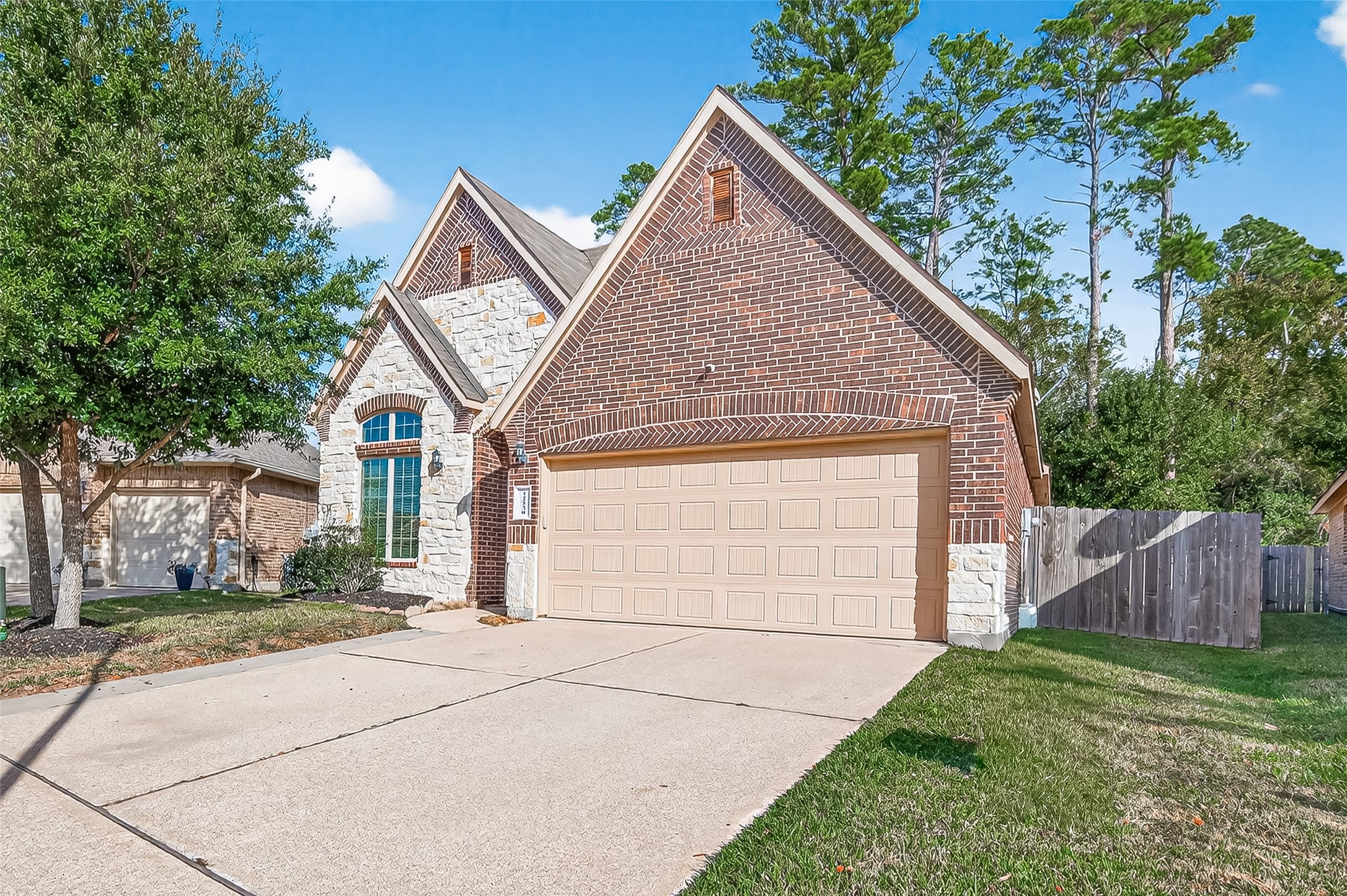 22530 Forbes Field Trail Spring, TX 77389 - Photo 2 of 50 a front view of a house with garden
