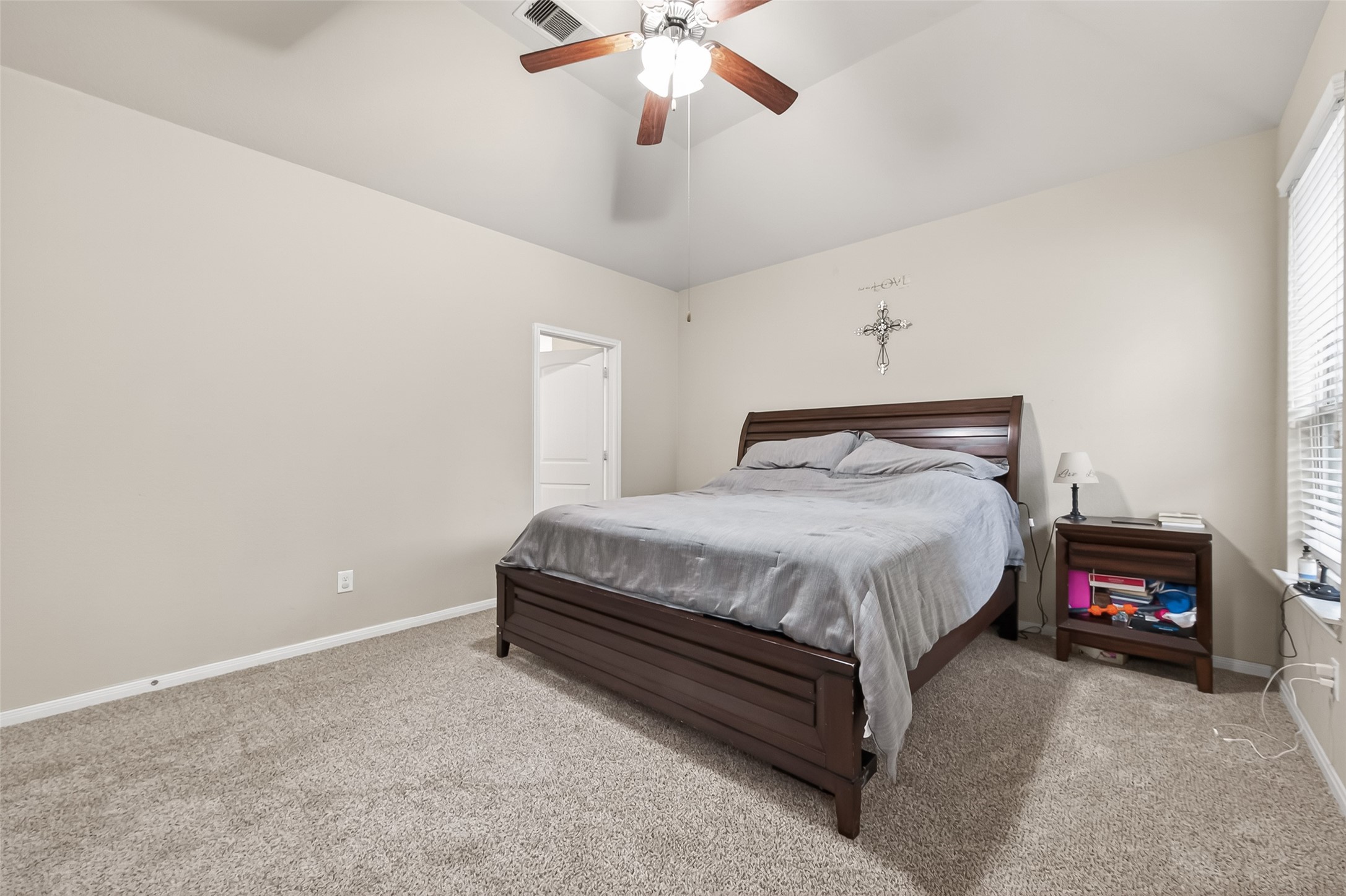 22530 Forbes Field Trail Spring, TX 77389 - Photo 25 of 50 a bedroom with a bed and a chandelier
