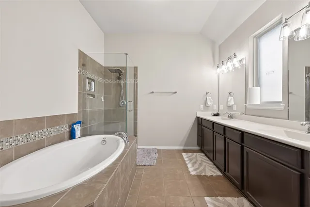 a bathroom with a bathtub and a sink