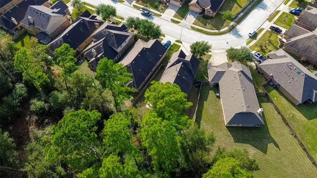 an aerial view of house with yard