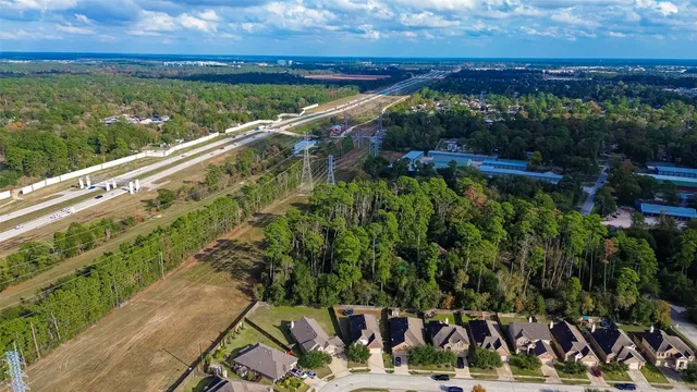 a view of a yard with wooden fence