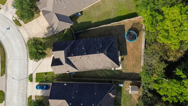 an aerial view of residential house with outdoor space and swimming pool