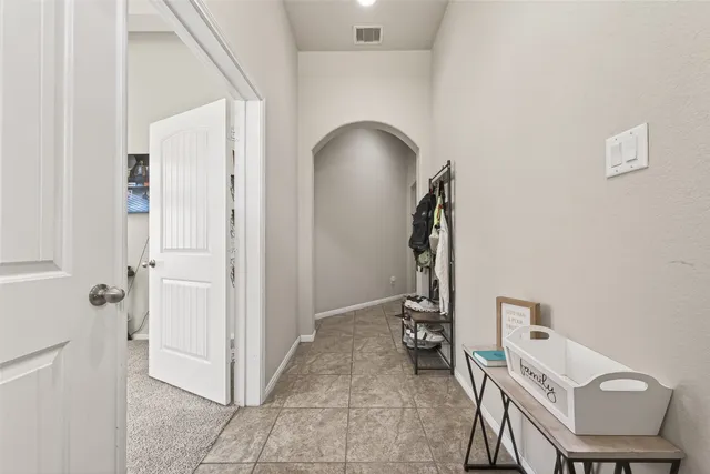 a view of a hallway with workspace