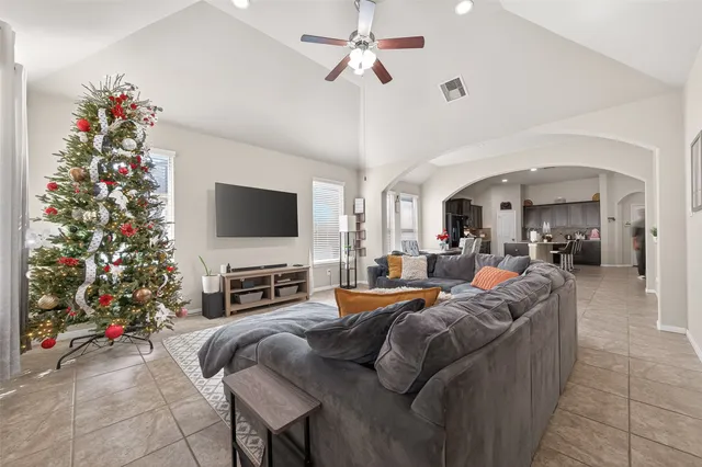 a living room with furniture and a flat screen tv
