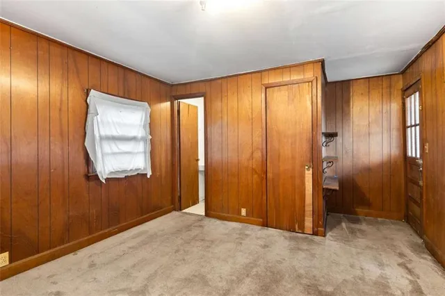 a view of an empty room and a window