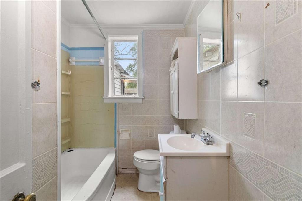 1638 Burton Avenue Macon, GA 31204 - Photo 15 of 15 a bathroom with a sink toilet and shower