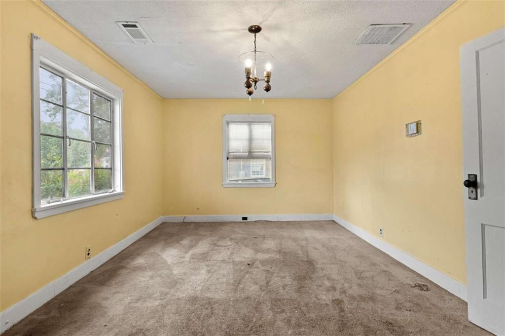 1638 Burton Avenue Macon, GA 31204 - Photo 4 of 15 a view of an empty room with a window