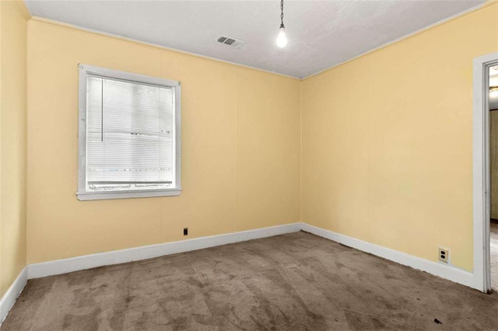 1638 Burton Avenue Macon, GA 31204 - Photo 8 of 15 an empty room with a window