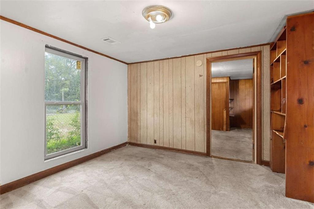 1638 Burton Avenue Macon, GA 31204 - Photo 9 of 15 an empty room with windows and closet