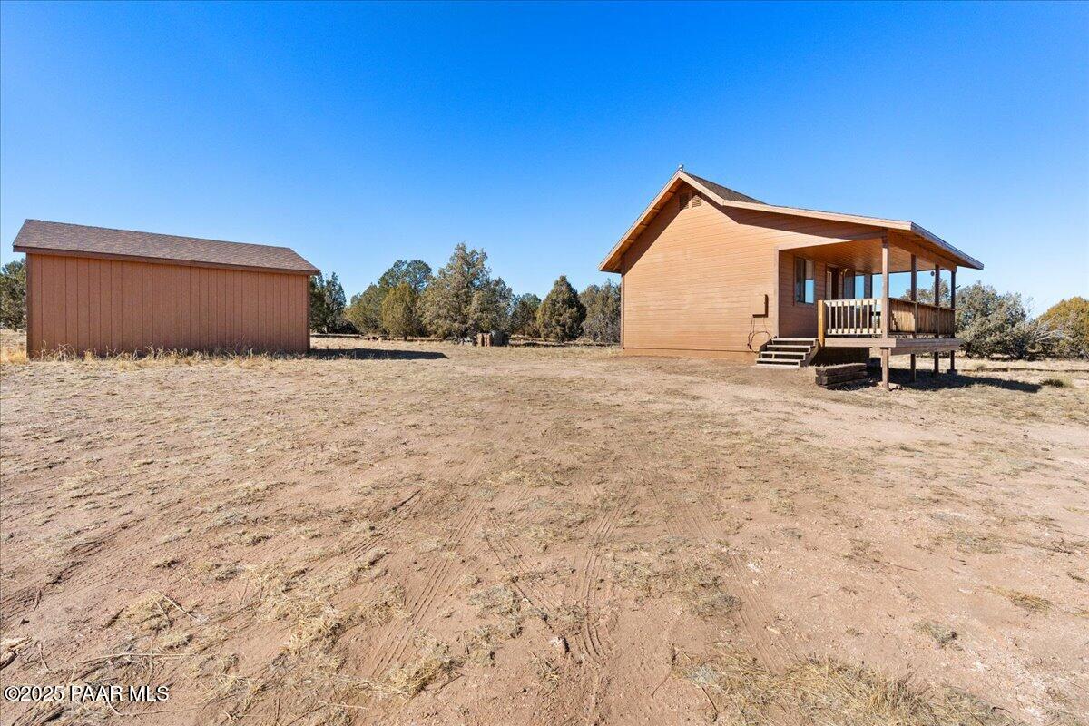 268 What Road Ash Fork, AZ 86320 - Photo 3 of 23 03-Front Yard with Storage Garage
