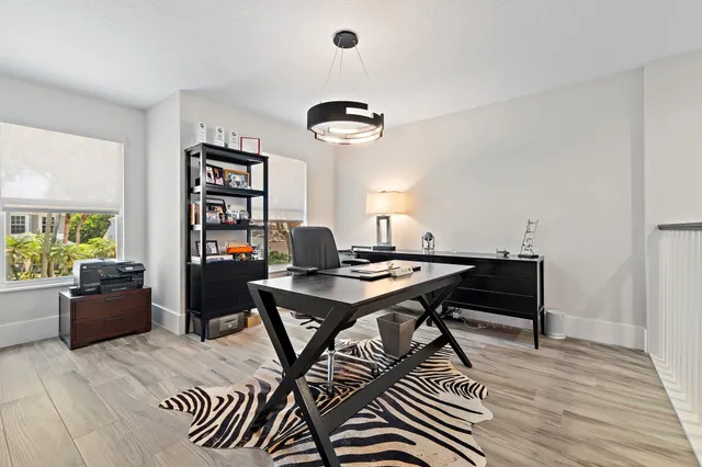 a view of a house with backyard porch and sitting area