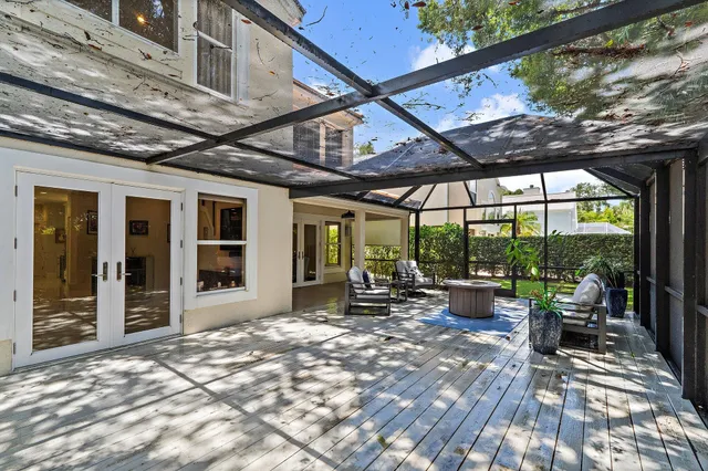 an aerial view of a house with a lake view