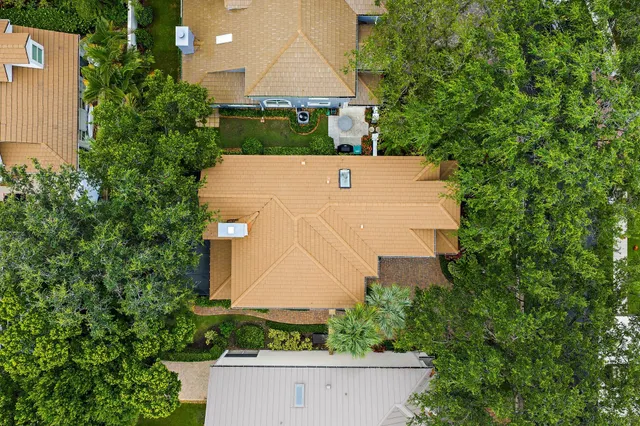 a living room with furniture chandelier and a large window