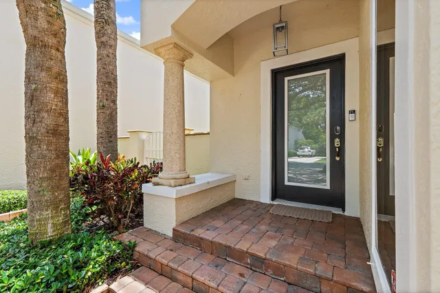 a view of a dining room with furniture and a window