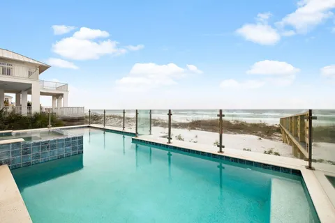 a bedroom with a bed couch and window