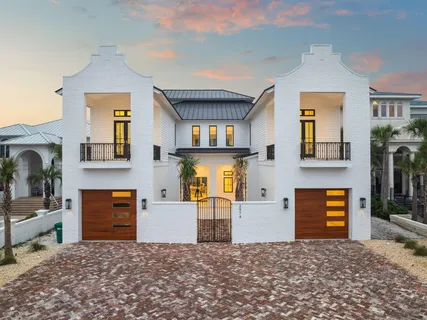 a living room with furniture a flat screen tv and a large window
