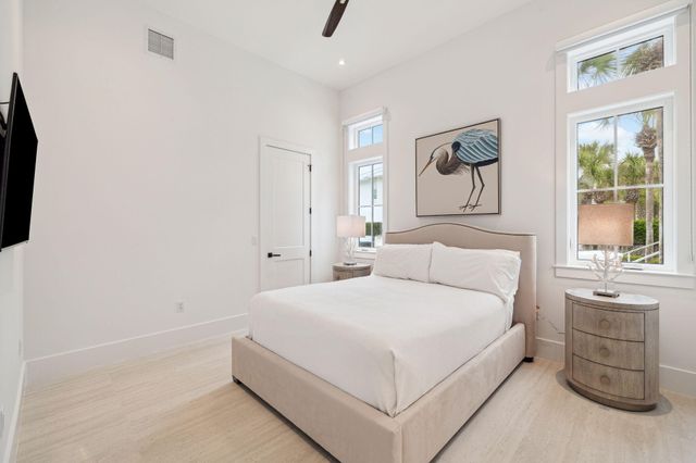 a kitchen with a sink a center island and cabinets