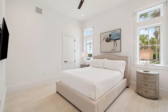 a kitchen with a sink a center island and cabinets