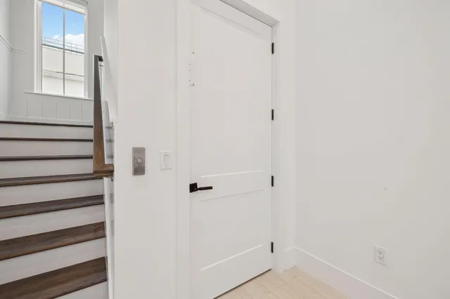 a kitchen with a table a sink and cabinets