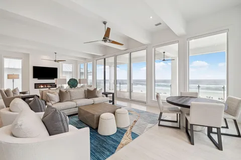 a living room with furniture and a rug