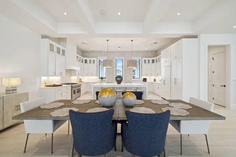 a bathroom with a granite countertop toilet a sink and mirror