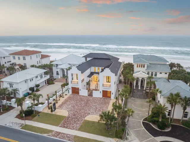 a view of an outdoor swimming pool and seating
