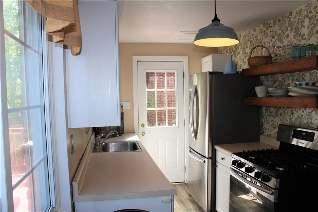 2023 Brookfield Road Pittsburgh, PA 15243 - Photo 5 of 21 a kitchen with a refrigerator and a stove