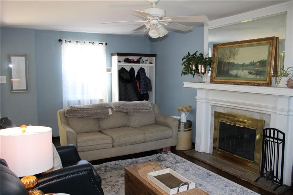 2023 Brookfield Road Pittsburgh, PA 15243 - Photo 8 of 21 a living room with furniture a window and a fireplace