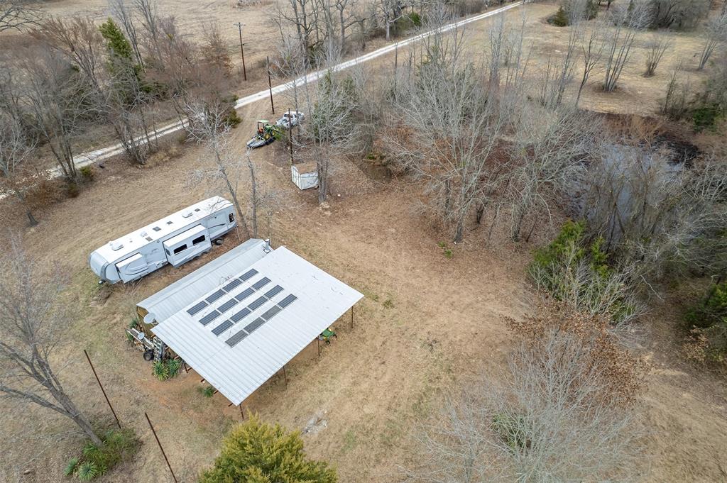 139 Northwest County Road, Unit 1061 Talco, TX 75487 - Photo 21 of 39 a view of a book in a yard