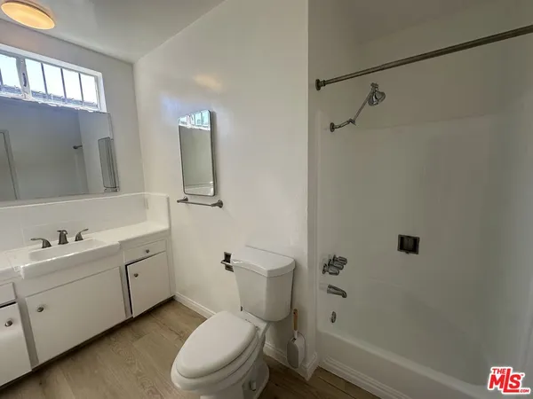 a bathroom with a shower and a toilet