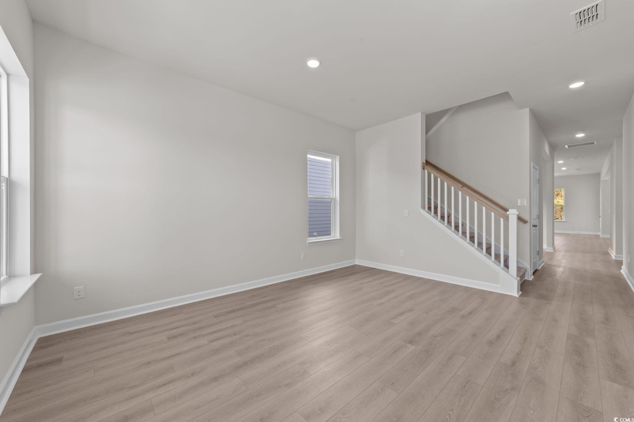 775 Ebb Tide Road Little River, SC 29566 - Photo 23 of 39 Spare room with stairway, recessed lighting, and light wood-style flooring