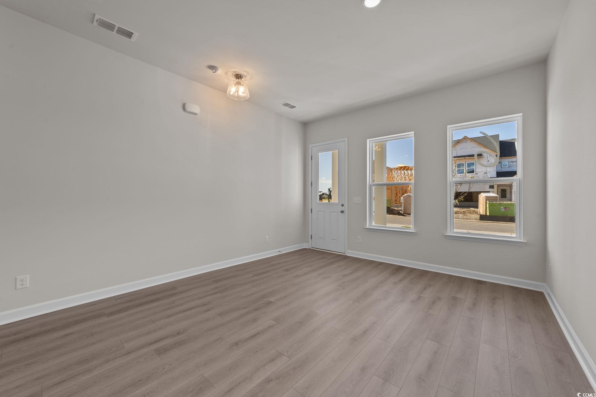 775 Ebb Tide Road Little River, SC 29566 - Photo 24 of 39 Unfurnished room with light wood-style floors and baseboards