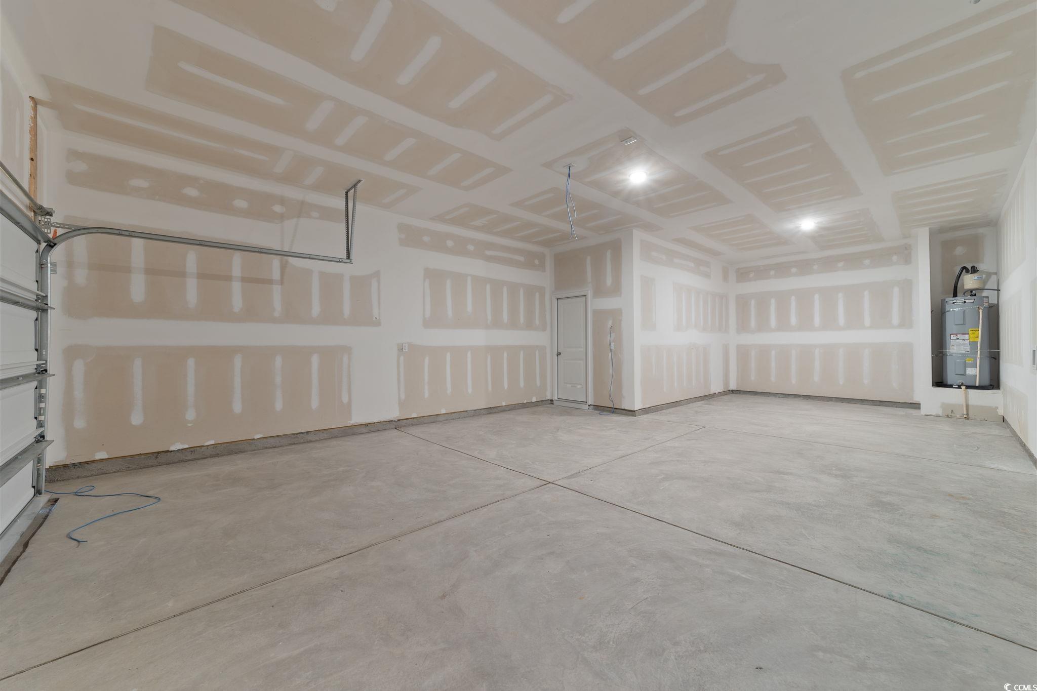 775 Ebb Tide Road Little River, SC 29566 - Photo 29 of 39 Garage with secured water heater