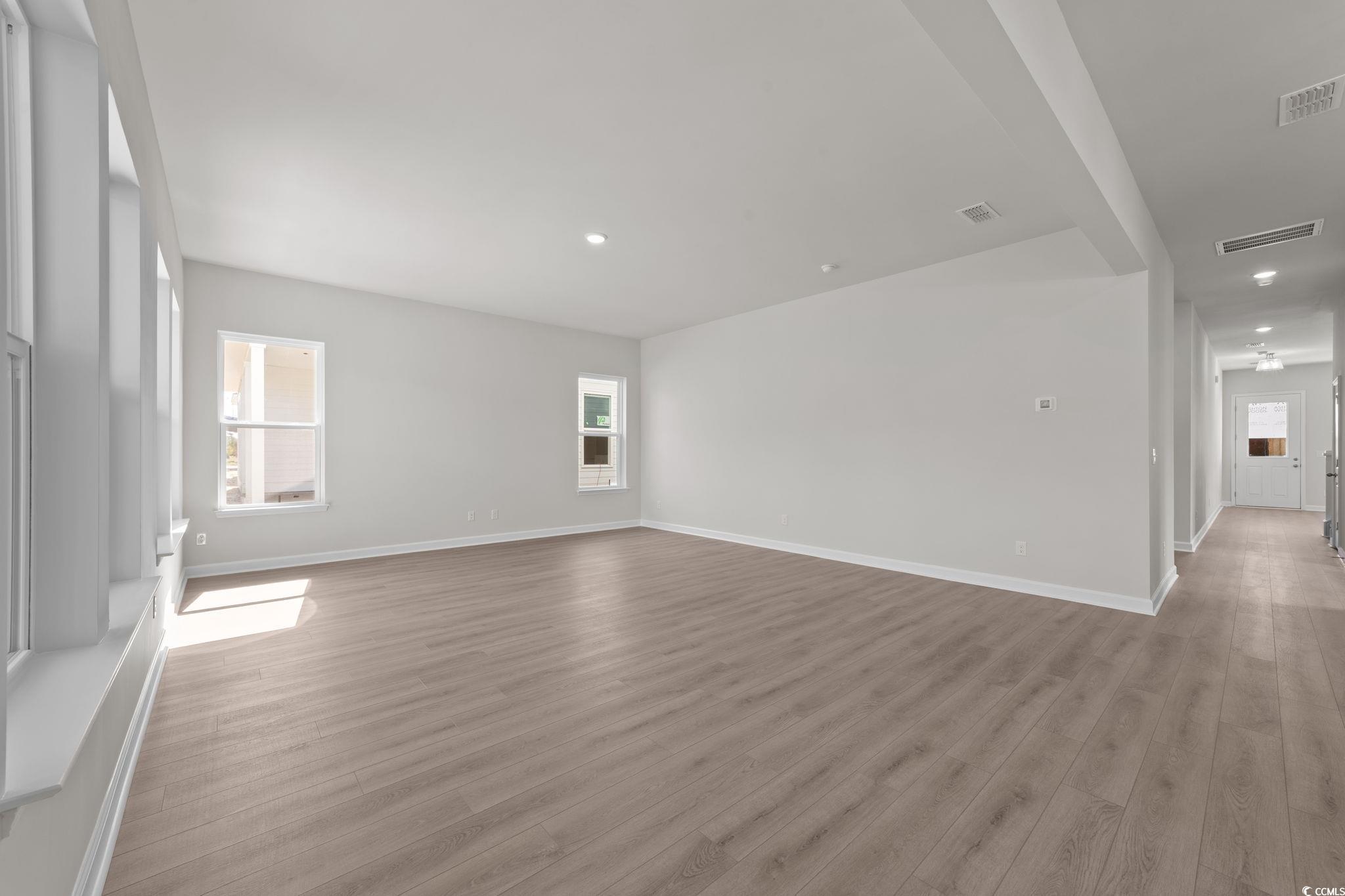 775 Ebb Tide Road Little River, SC 29566 - Photo 30 of 39 Unfurnished living room featuring light wood-type flooring and recessed lighting