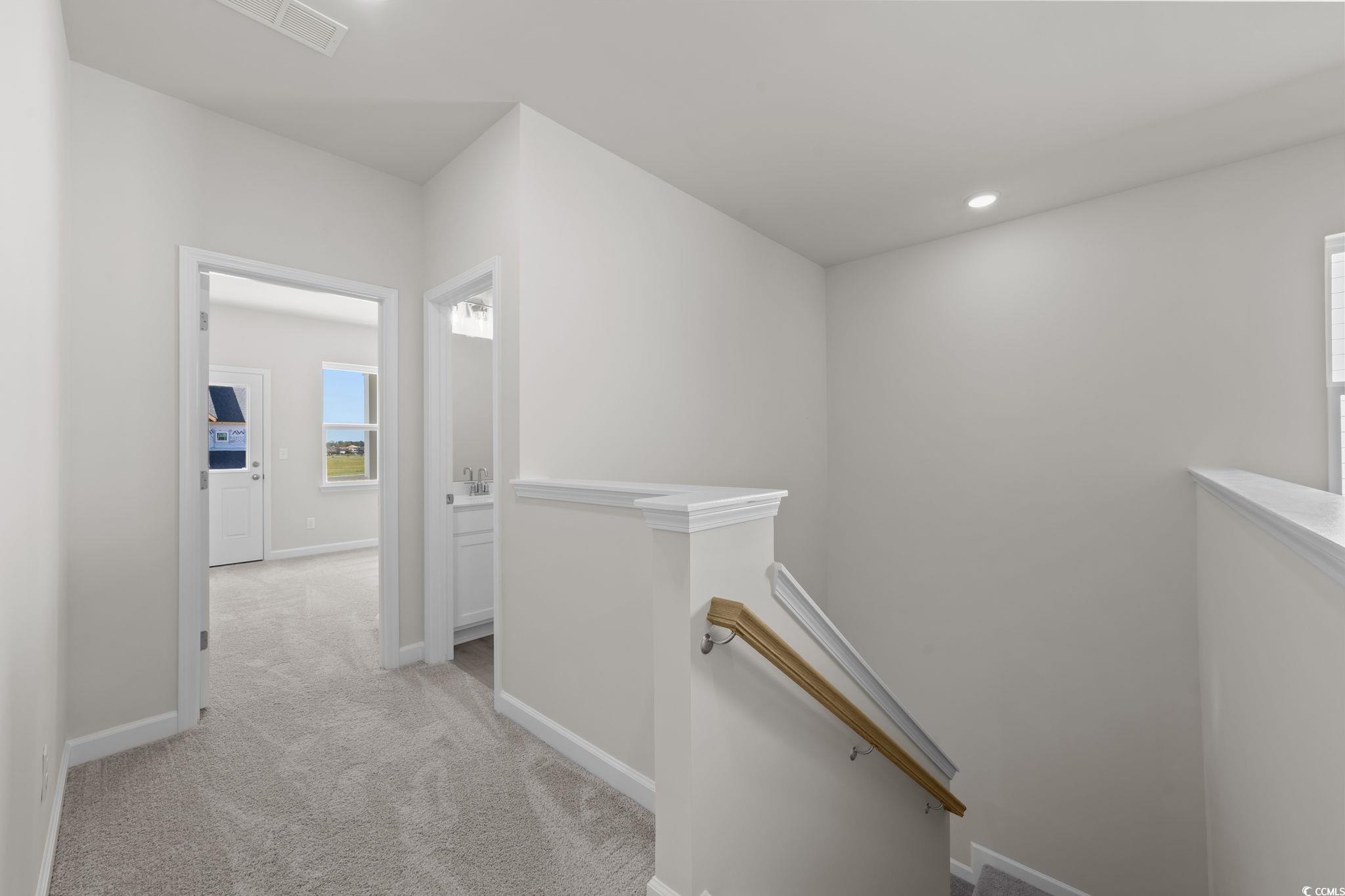 775 Ebb Tide Road Little River, SC 29566 - Photo 33 of 39 Corridor with an upstairs landing, light colored carpet, and recessed lighting