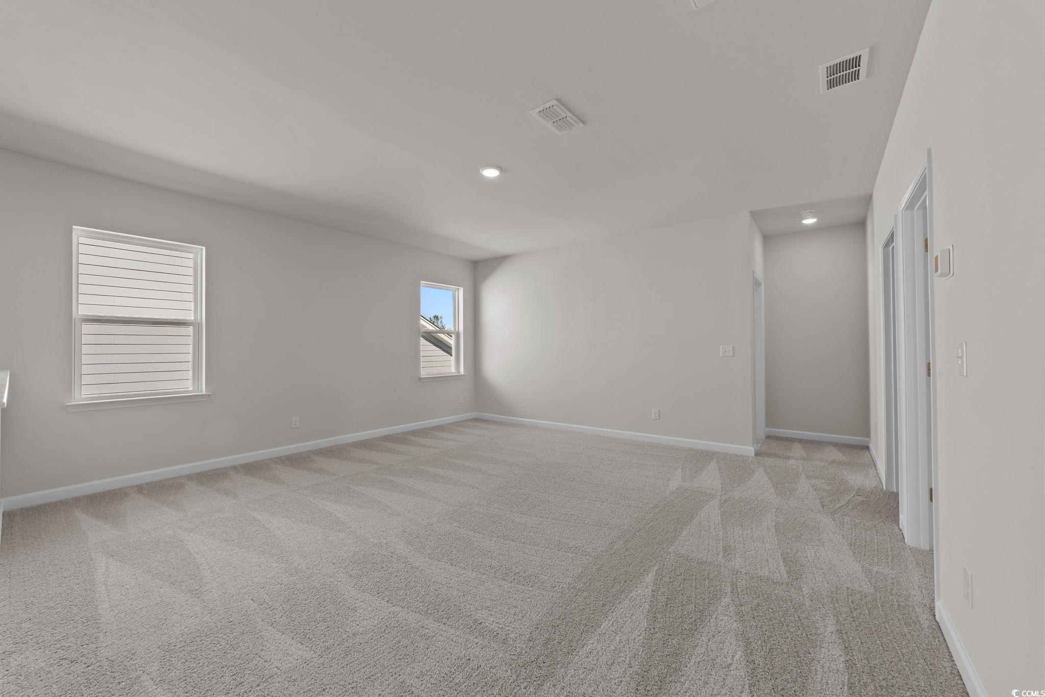 775 Ebb Tide Road Little River, SC 29566 - Photo 34 of 39 Unfurnished room with light colored carpet and recessed lighting