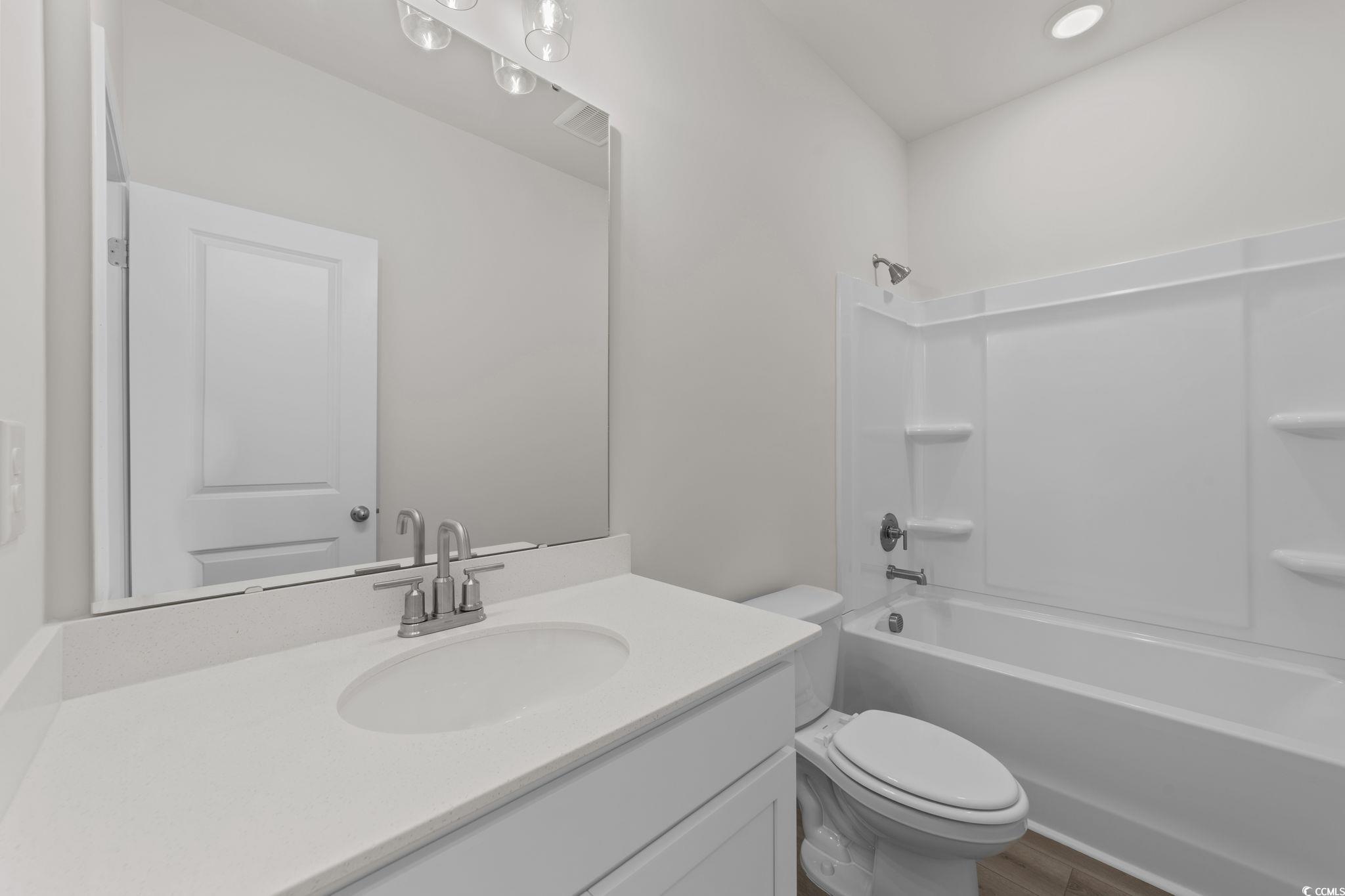 775 Ebb Tide Road Little River, SC 29566 - Photo 36 of 39 Empty room with light carpet and recessed lighting