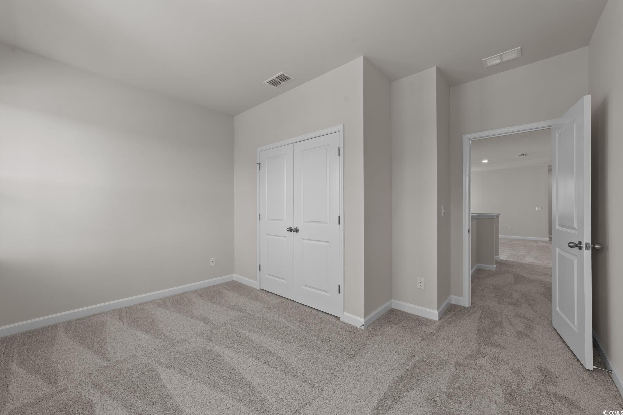 775 Ebb Tide Road Little River, SC 29566 - Photo 38 of 39 Entrance foyer featuring plenty of natural light and light colored carpet